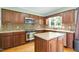 Modern kitchen boasts stainless steel appliances, a center island, and beautiful backsplash for a stylish cooking space at 2523 Lovette Ln, Graham, NC 27253