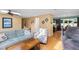 Open-concept living room showcases seamless flow into the kitchen with hardwood floors and neutral paint at 2523 Lovette Ln, Graham, NC 27253