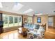 Comfortable living room with skylights, large picture window, and hardwood floors provides a warm and inviting space at 2523 Lovette Ln, Graham, NC 27253