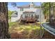 View of a spacious backyard with a wooden deck and partial view of the home's rear at 3013 Brassfield Dr, Rocky Mount, NC 27803