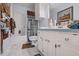 Bathroom features marble floors, large vanity, shower with floral curtain and medicine cabinet at 3013 Brassfield Dr, Rocky Mount, NC 27803