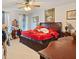 Bedroom features a large bed, ceiling fan, two windows with blinds, and wood furniture at 3013 Brassfield Dr, Rocky Mount, NC 27803
