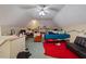 This attic bedroom has a bed, an old chair, sofa and personal effects at 3013 Brassfield Dr, Rocky Mount, NC 27803