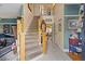 Bright foyer with beige walls, staircase leading up, and views to other rooms at 3013 Brassfield Dr, Rocky Mount, NC 27803