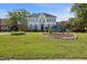 Charming two-story house with blue shutters, manicured lawn, and decorative landscaping at 3013 Brassfield Dr, Rocky Mount, NC 27803