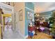 Open hallway with yellow and blue walls leading into a dining area with wooden table and chairs at 3013 Brassfield Dr, Rocky Mount, NC 27803