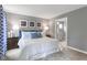 Stylish bedroom featuring a large bed, nightstands and ensuite bathroom with natural light at 318 Rothbury Ct, Sanford, NC 27330