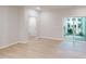 Inviting living space with sliding glass doors leading to a patio, complemented by light floors at 3193 Mission Olive Pl # 351, New Hill, NC 27562
