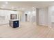 Expansive living area featuring stainless steel appliances, island, staircase, and light-colored floors at 3193 Mission Olive Pl # 351, New Hill, NC 27562