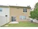 View of the backyard featuring a lawn and a sliding glass door that leads into the property at 321 Westgrove Ct, Durham, NC 27703