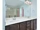 Bathroom with double sink vanity, large mirror, and walk-in tiled shower at 321 Westgrove Ct, Durham, NC 27703