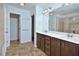 Bathroom with double sink vanity, and large mirror at 321 Westgrove Ct, Durham, NC 27703