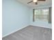 Cozy bedroom with natural light, carpet flooring, and a ceiling fan at 321 Westgrove Ct, Durham, NC 27703