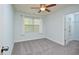Bedroom featuring neutral walls, plush carpet, and natural light at 321 Westgrove Ct, Durham, NC 27703