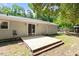 A small deck with access to the backyard and storage shed at 3216 Idlewood Village Dr, Raleigh, NC 27610