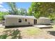 Spacious backyard with a small deck and lush green lawn at 3216 Idlewood Village Dr, Raleigh, NC 27610