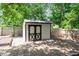 Backyard shed with a black and white design at 3216 Idlewood Village Dr, Raleigh, NC 27610
