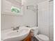 Clean bathroom with modern fixtures, white walls, and wood-grain vanity at 3216 Idlewood Village Dr, Raleigh, NC 27610