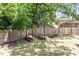 Wood-fenced backyard with garden beds at 3216 Idlewood Village Dr, Raleigh, NC 27610