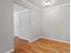 Bright living room with hardwood floors, neutral walls, and white trim at 3216 Idlewood Village Dr, Raleigh, NC 27610