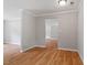 Open living room with hardwood floors leading to the front entrance at 3216 Idlewood Village Dr, Raleigh, NC 27610
