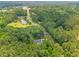 Aerial view showcasing the house in a serene setting with lush trees at 322 Scheer Ave, Durham, NC 27703