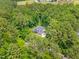 Aerial shot of a home nestled in lush greenery, providing a sense of privacy and seclusion at 322 Scheer Ave, Durham, NC 27703