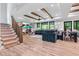 Spacious basement with cozy couch, table and chairs and stairs to access the upper level at 322 Scheer Ave, Durham, NC 27703
