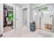 Bathroom with a glass-enclosed shower, closet, and tiled floors for a clean and modern look at 322 Scheer Ave, Durham, NC 27703