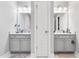 Elegant bathroom showcasing dual sinks with vanity cabinets and neutral color palette at 322 Scheer Ave, Durham, NC 27703