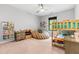 Cozy bedroom with a bunk bed, comfortable beanbag, ceiling fan, and cute decor at 322 Scheer Ave, Durham, NC 27703