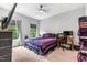 Cozy bedroom with a large bed, carpeted floor, window views and comfortable decor at 322 Scheer Ave, Durham, NC 27703