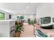 Bright bonus room featuring a large wall-mounted TV and views to the lower level at 322 Scheer Ave, Durham, NC 27703