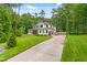 Beautiful two-story home with a long driveway and attached two-car garage at 322 Scheer Ave, Durham, NC 27703