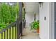 Inviting front porch featuring rocking chairs, hanging baskets, and lush landscaping at 322 Scheer Ave, Durham, NC 27703