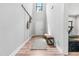 Inviting entryway features a light wood floor, bench, and decor that offers a warm welcome at 322 Scheer Ave, Durham, NC 27703