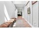 Bright hallway with hardwood floors, stylish decor, and access to living areas at 322 Scheer Ave, Durham, NC 27703