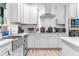 Well-lit kitchen equipped with stainless steel appliances, modern cabinetry, and functional layout at 322 Scheer Ave, Durham, NC 27703