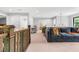Open living space featuring modern lighting, neutral walls, and comfortable dark gray seating at 322 Scheer Ave, Durham, NC 27703