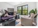 Dedicated home office space with a modern computer setup and comfortable lounge chair at 322 Scheer Ave, Durham, NC 27703