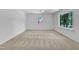 Well-lit carpeted bedroom with windows, providing ample natural light and a comfortable atmosphere at 3221 Ward Rd, Raleigh, NC 27604