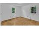 Inviting bedroom with hardwood floors and natural light from two windows at 3221 Ward Rd, Raleigh, NC 27604