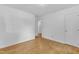 A spacious, bright bedroom showcases hardwood floors and a neutral palette at 3221 Ward Rd, Raleigh, NC 27604