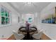 Charming dining room with round table and kitchen view, perfect for intimate meals at 3221 Ward Rd, Raleigh, NC 27604