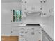 A close-up of the kitchen highlighting the countertops, cabinets, and window at 3221 Ward Rd, Raleigh, NC 27604