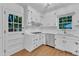 Kitchen featuring stainless appliances, white cabinets and a window with a view at 3221 Ward Rd, Raleigh, NC 27604