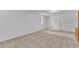 Unfurnished room features neutral carpet, white walls, and natural light from a window at 3221 Ward Rd, Raleigh, NC 27604