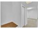 View of the white-walled stairway with wood treads and access to the carpeted living area at 3221 Ward Rd, Raleigh, NC 27604