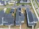 Aerial shot of modern homes, showing well-kept yards, garages, and a structured neighborhood layout at 34 Millennium Dr, Pittsboro, NC 27312