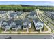 Bird's-eye view of a vibrant residential community, with lush greenery and orderly street design at 34 Millennium Dr, Pittsboro, NC 27312